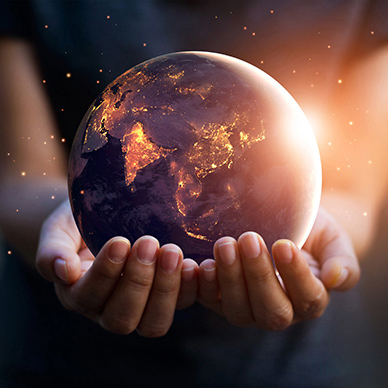 Earth at night was holding in human hands. Earth day. Energy sav